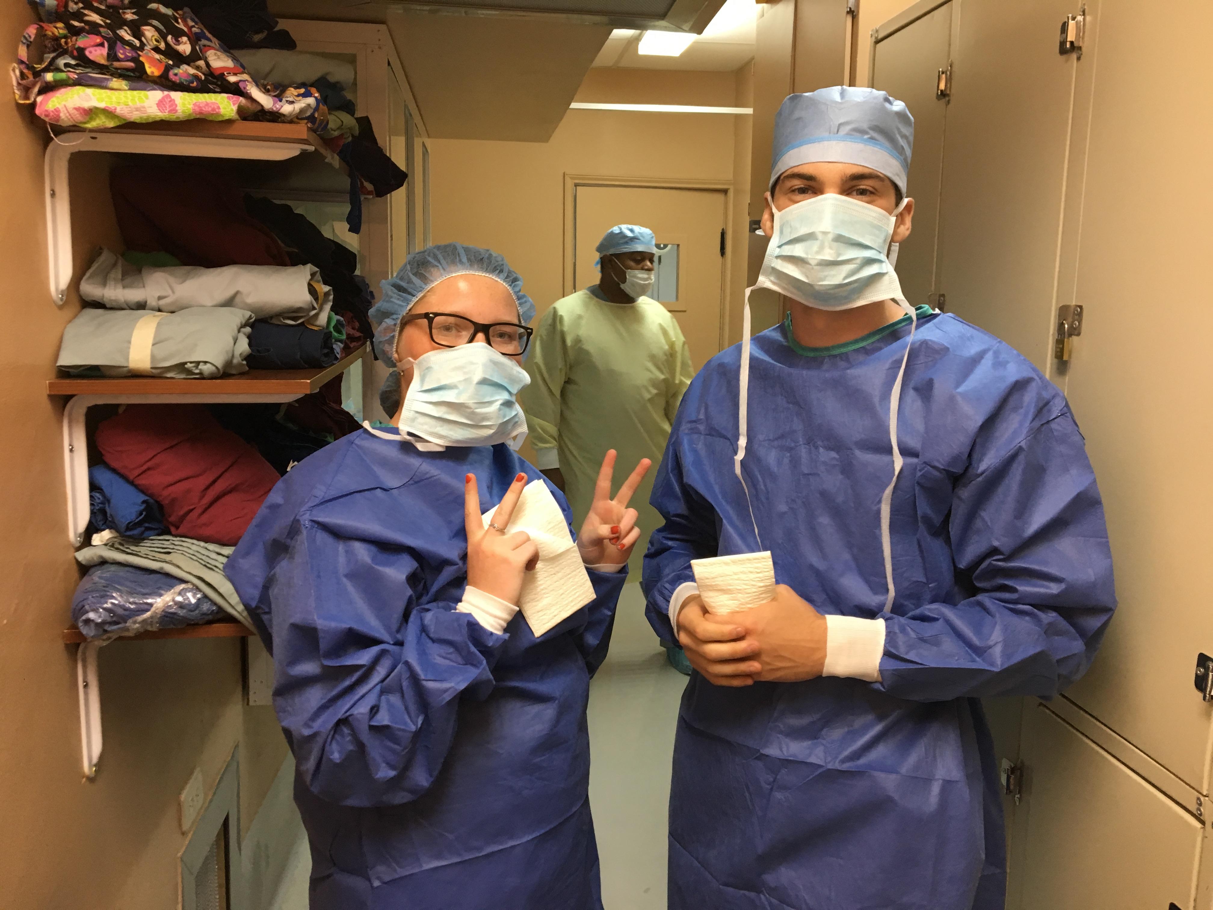 Public Health interns from Projects Abroad heading to the operating room to watch over local doctors whilst on their Public Health internship in Belize. Two Projects Abroad interns are pictured getting ready to go to an operating room and watch over local doctors whilst on their Public Health internship in Belize.